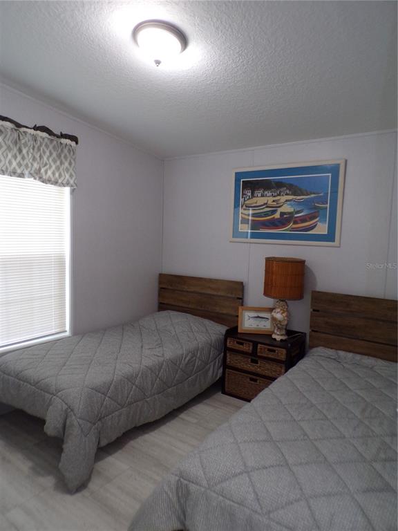 721 Marlin Drive Punta Gorda, FL 33950 - Photo 25 of 50 a bedroom with a bed and a window