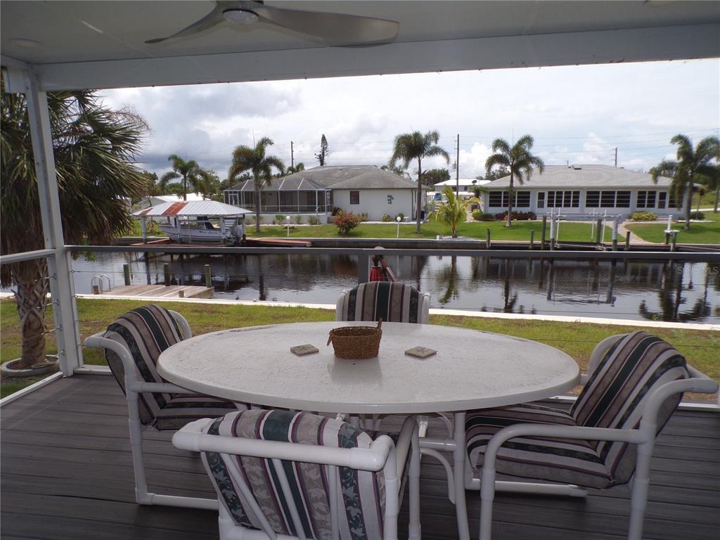721 Marlin Drive Punta Gorda, FL 33950 - Photo 29 of 50 a view of a dining room with furniture and a floor to ceiling window