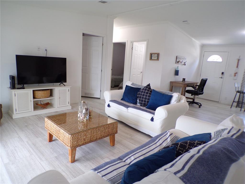 721 Marlin Drive Punta Gorda, FL 33950 - Photo 34 of 50 a living room with furniture and a flat screen tv