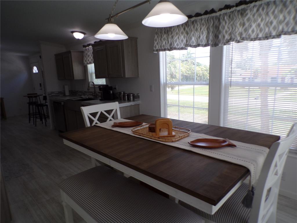 721 Marlin Drive Punta Gorda, FL 33950 - Photo 36 of 50 a kitchen with a table and a stove top oven