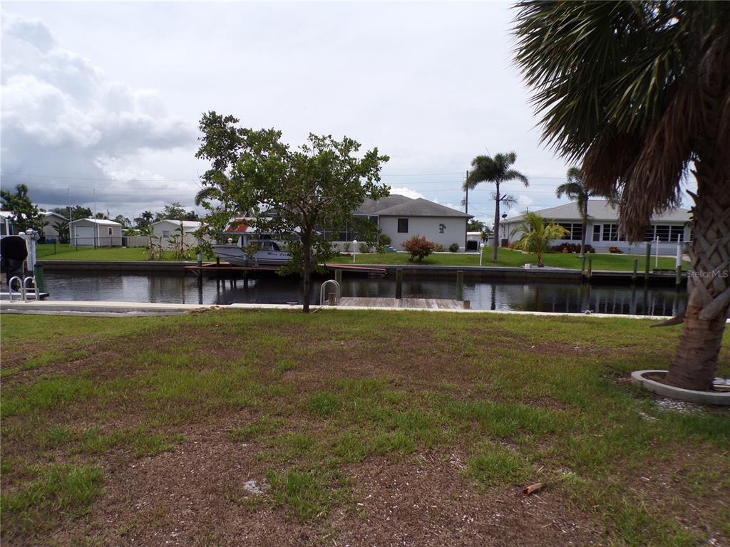 721 Marlin Drive Punta Gorda, FL 33950 - Photo 46 of 50 a view of a lake with a large trees