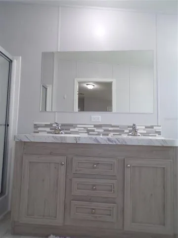 a bedroom with a bed and a chair