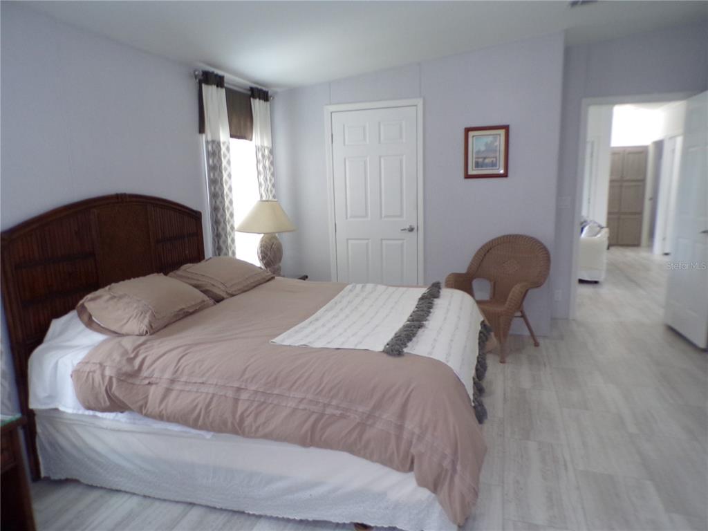 721 Marlin Drive Punta Gorda, FL 33950 - Photo 50 of 50 a bedroom with a bed and a chair