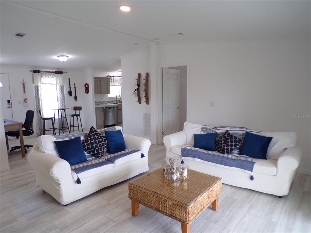 721 Marlin Drive Punta Gorda, FL 33950 - Photo 9 of 50 a living room with furniture a rug and a table