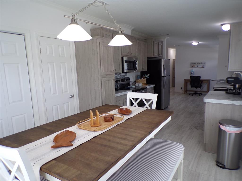 721 Marlin Drive Punta Gorda, FL 33950 - Photo 10 of 50 a room with furniture and a chandelier