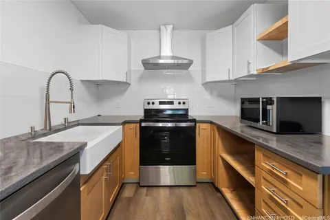 a kitchen with a stove and a sink
