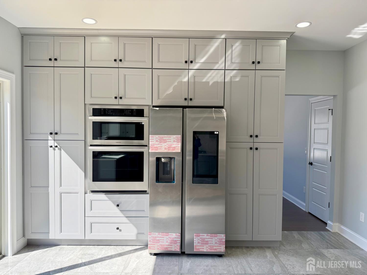 40 Foyer Street Edison, NJ 08817 - Photo 3 of 12 a kitchen with stainless steel appliances a refrigerator and cabinets