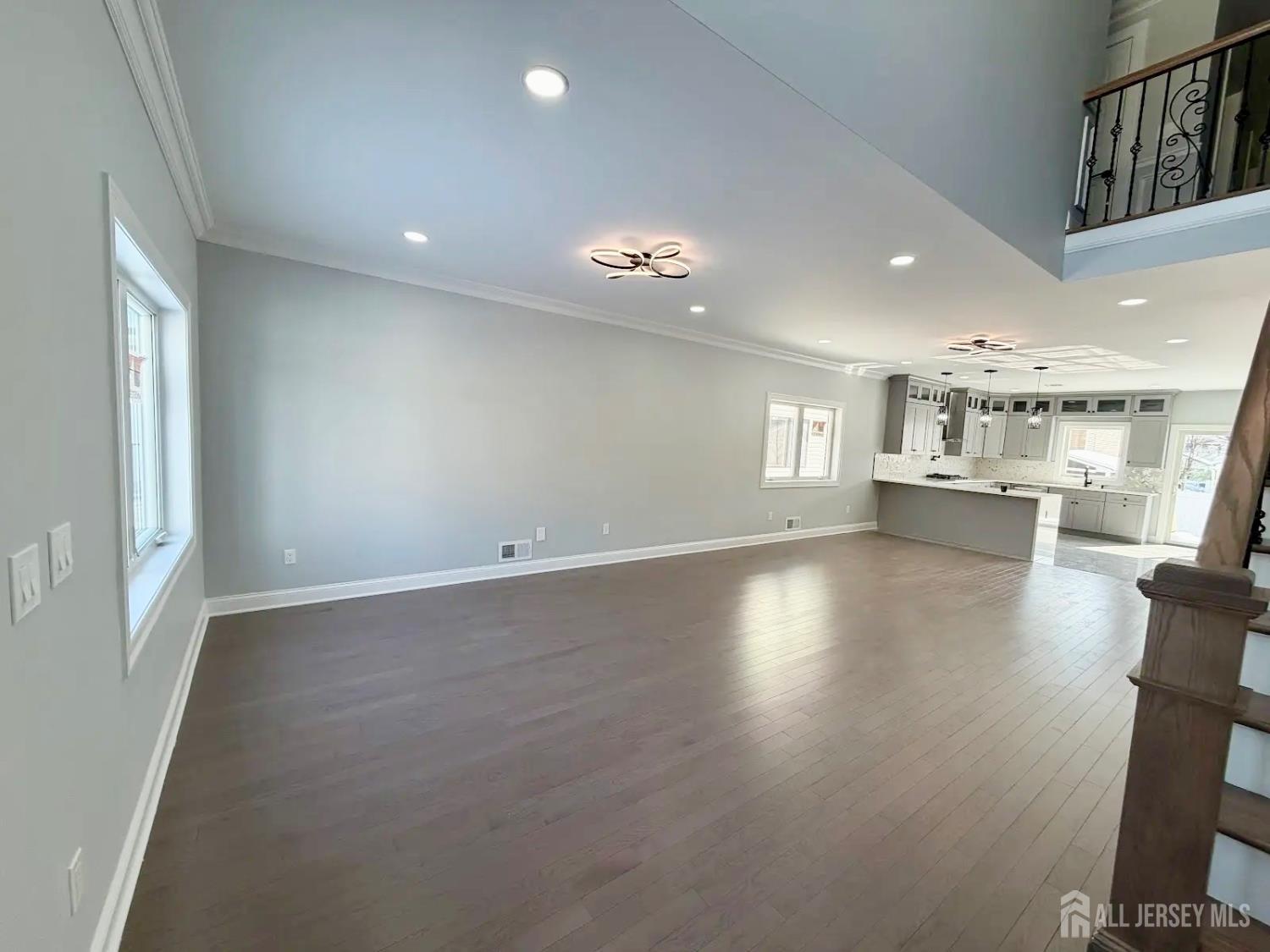40 Foyer Street Edison, NJ 08817 - Photo 4 of 12 an empty room with wooden floor and windows