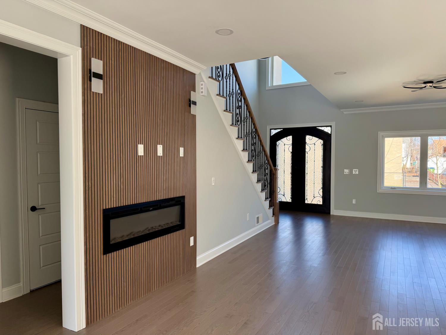 40 Foyer Street Edison, NJ 08817 - Photo 5 of 12 an empty room with wooden floor and windows