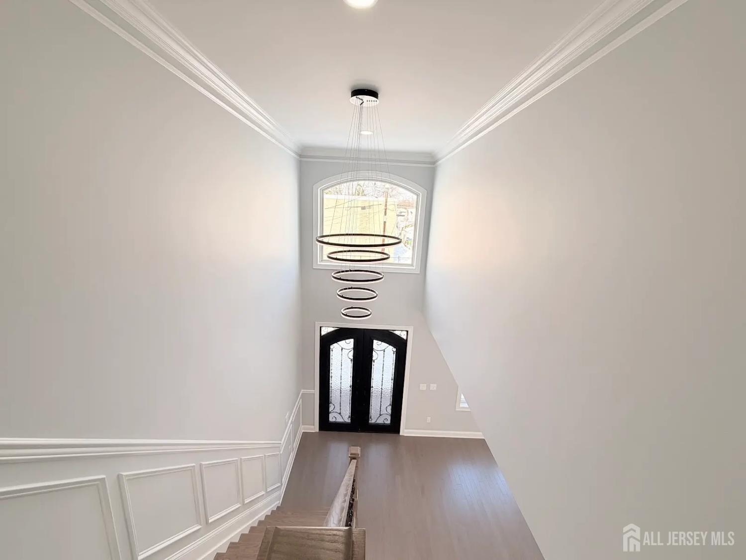 40 Foyer Street Edison, NJ 08817 - Photo 9 of 12 a view of empty room with wooden floor and fan