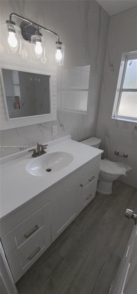 200 Northwest 9th Street Boca Raton, FL 33432 - Photo 12 of 61 a bathroom with a sink and a mirror