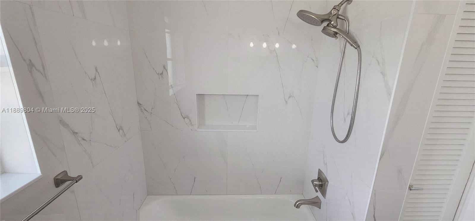 200 Northwest 9th Street Boca Raton, FL 33432 - Photo 17 of 61 a bathroom with a bath tub and shower