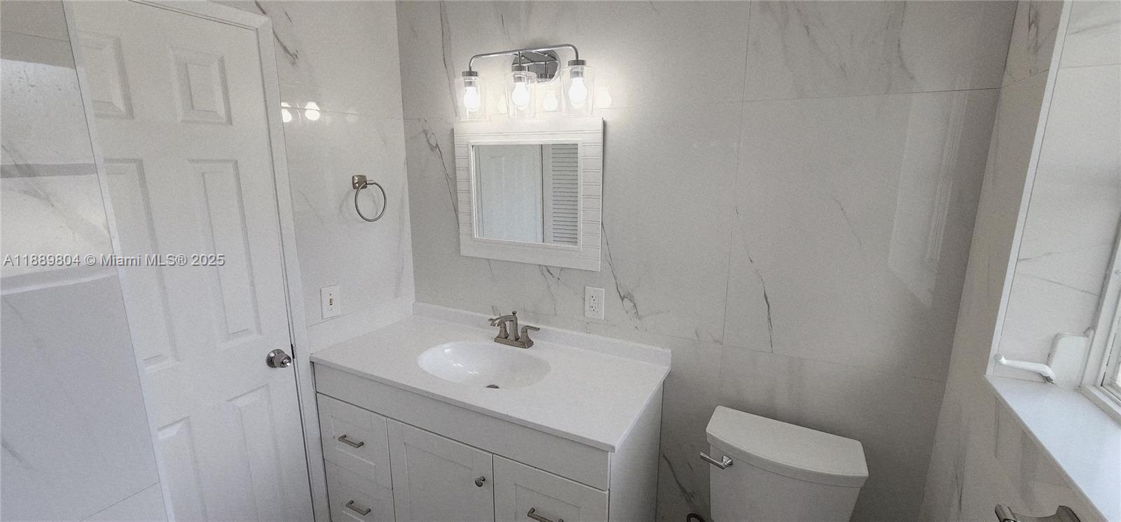 200 Northwest 9th Street Boca Raton, FL 33432 - Photo 21 of 61 a bathroom with a sink a toilet and shower