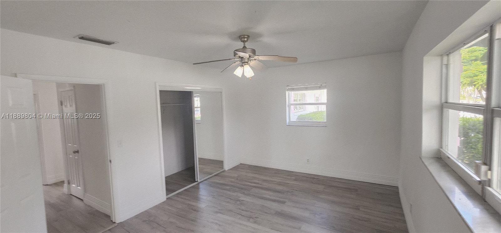 200 Northwest 9th Street Boca Raton, FL 33432 - Photo 24 of 61 wooden floor in an empty room with a window