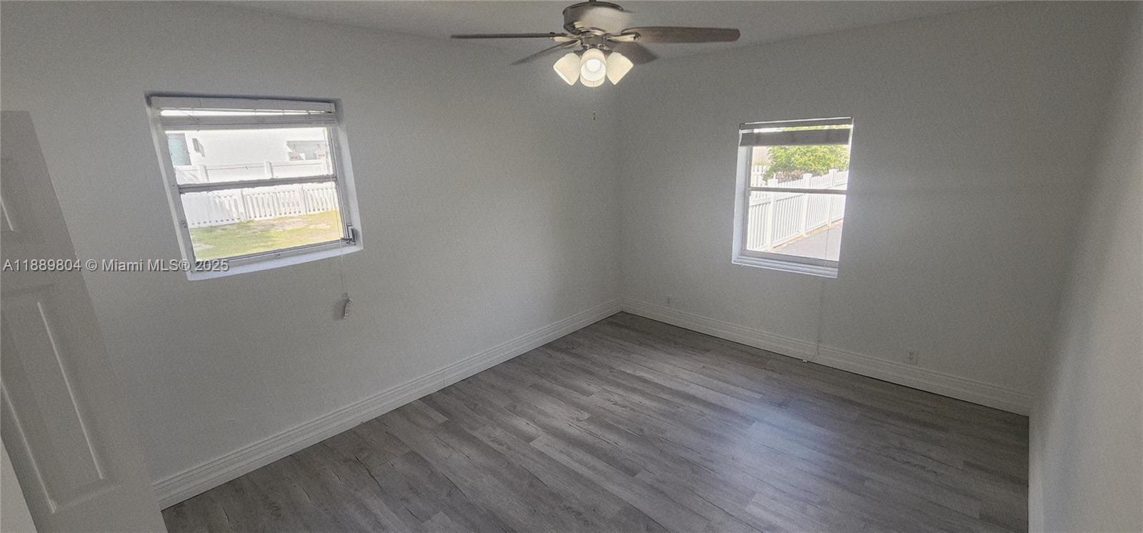 200 Northwest 9th Street Boca Raton, FL 33432 - Photo 40 of 61 wooden floor in an empty room with a window