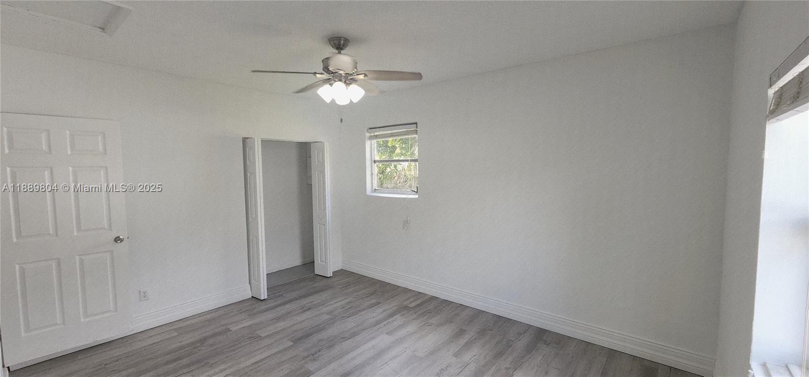 200 Northwest 9th Street Boca Raton, FL 33432 - Photo 42 of 61 a view of an empty room with window chandelier fan
