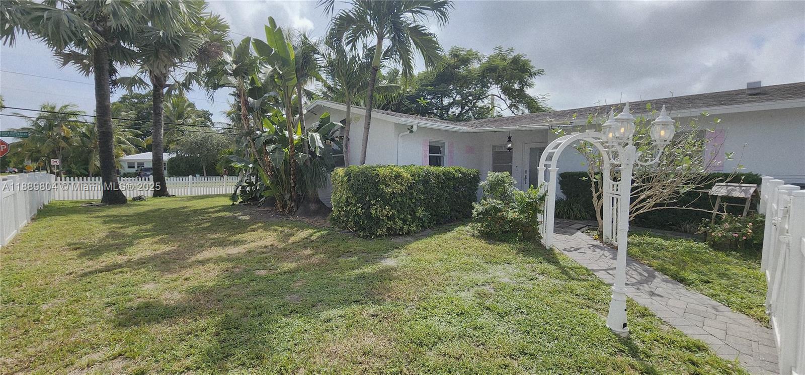 200 Northwest 9th Street Boca Raton, FL 33432 - Photo 52 of 61 a view of a house with backyard and a tree