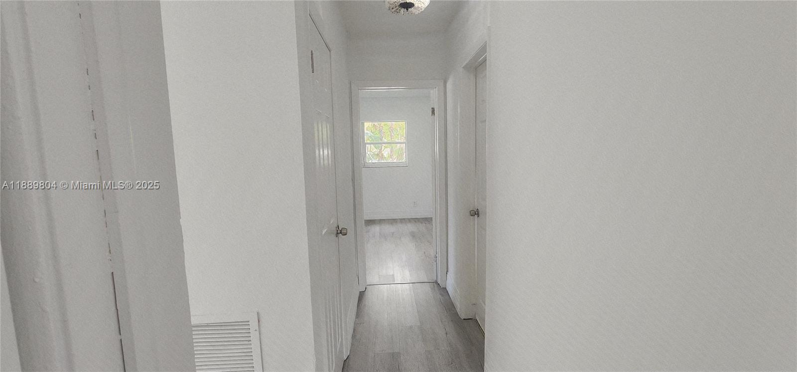 200 Northwest 9th Street Boca Raton, FL 33432 - Photo 10 of 61 a view of empty room with wooden floor