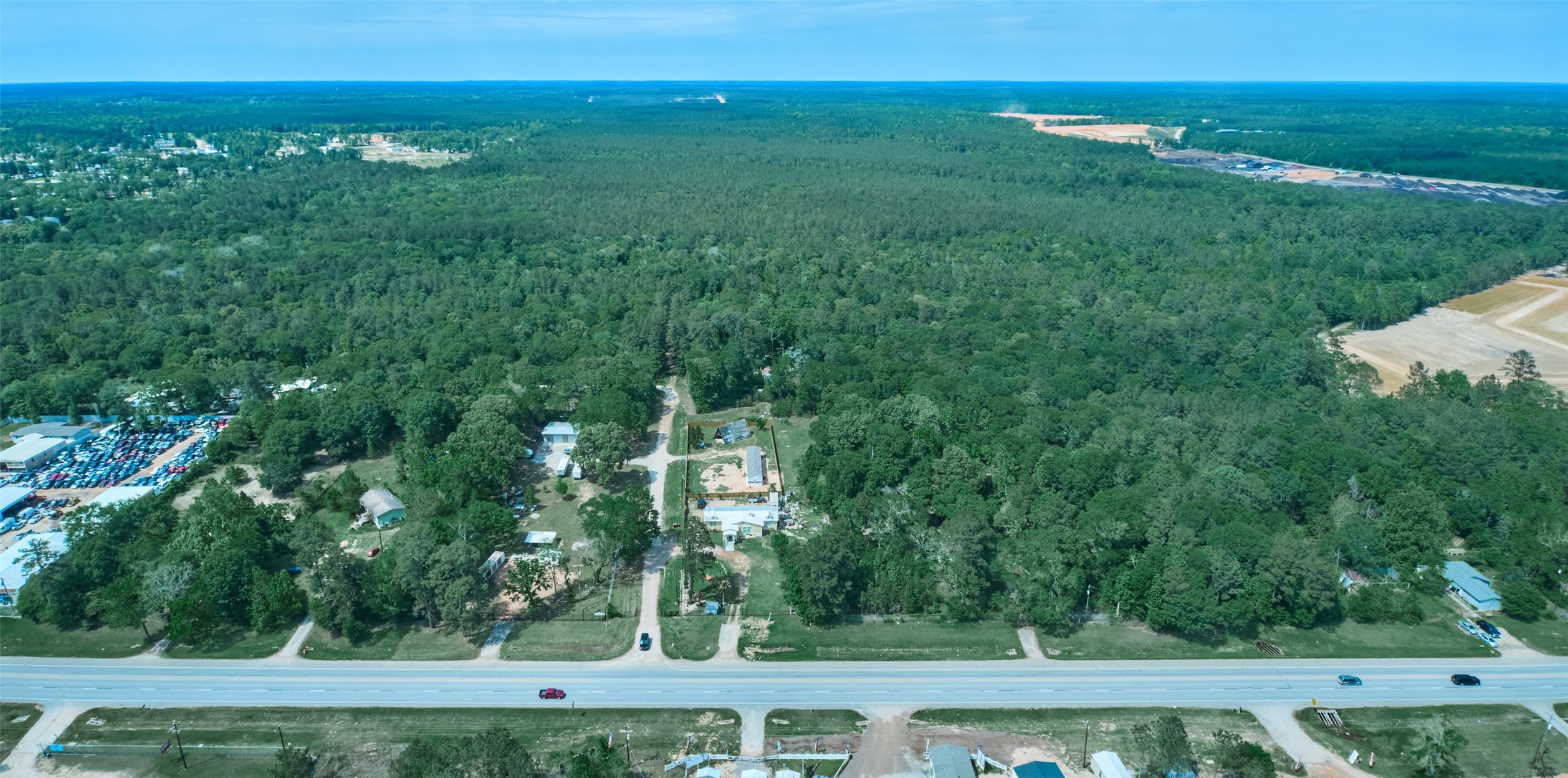 34+ acres at Hwy 105 and Crowson Ridge Road.  Easy access.  See residential development to right, business and commercial across and to the left.