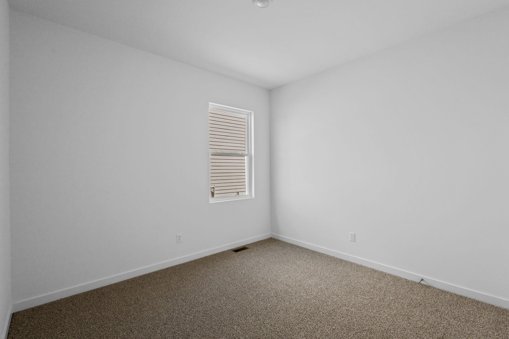 7602 West 106th Place Crown Point, IN 46307 - Photo 16 of 22 an empty room with a window