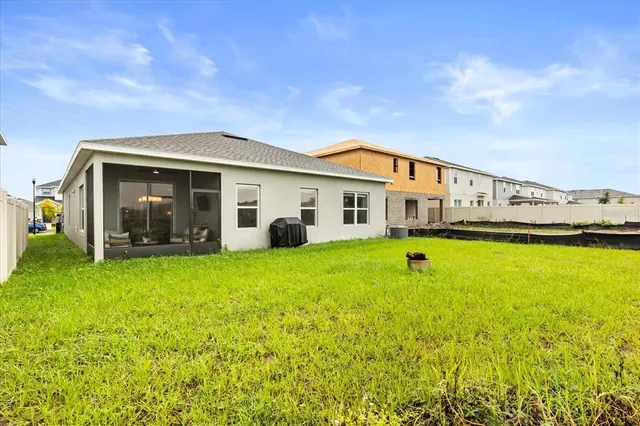 a view of a house with pool and garden