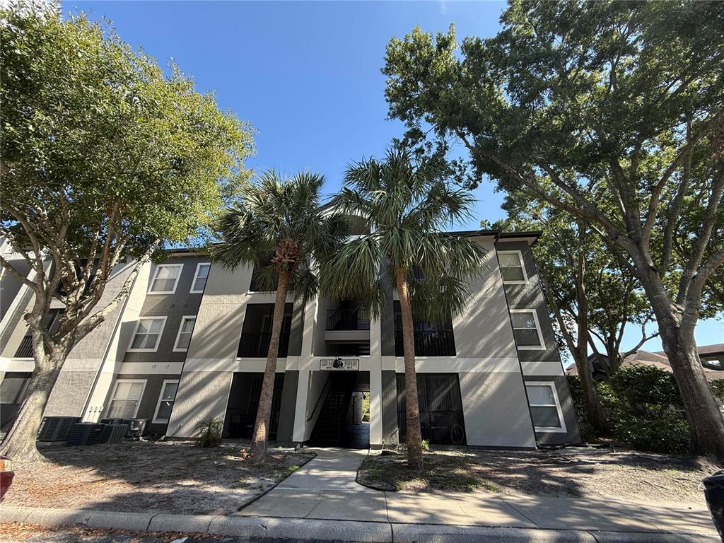 8915 Latrec Avenue, Unit 2307 Orlando, FL 32819 - Photo 1 of 5 a view of a house with a street