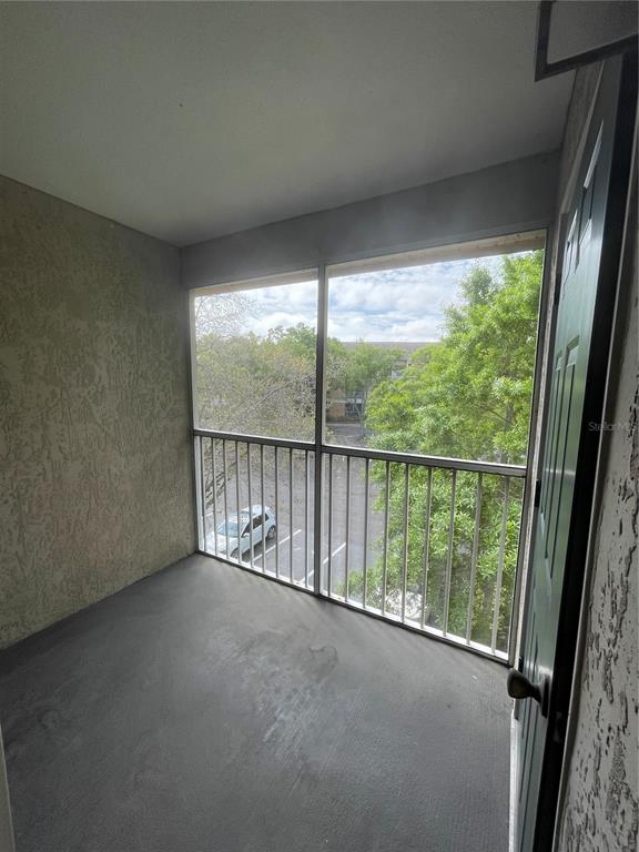 8915 Latrec Avenue, Unit 2307 Orlando, FL 32819 - Photo 5 of 5 a view of a room with large windows
