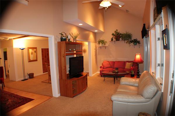 21 Longfellow Road Natick, MA 01760 - Photo 11 of 28 a living room with furniture a lamp and a fireplace