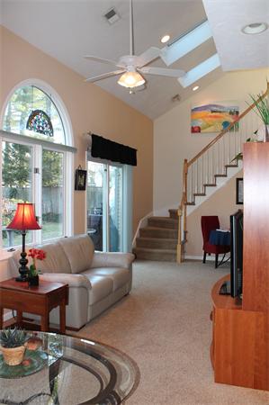 21 Longfellow Road Natick, MA 01760 - Photo 13 of 28 a living room with furniture and a chandelier
