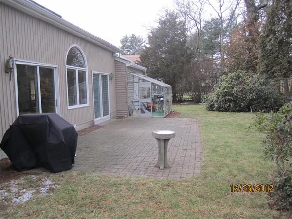 21 Longfellow Road Natick, MA 01760 - Photo 5 of 28 a front view of a house with garden