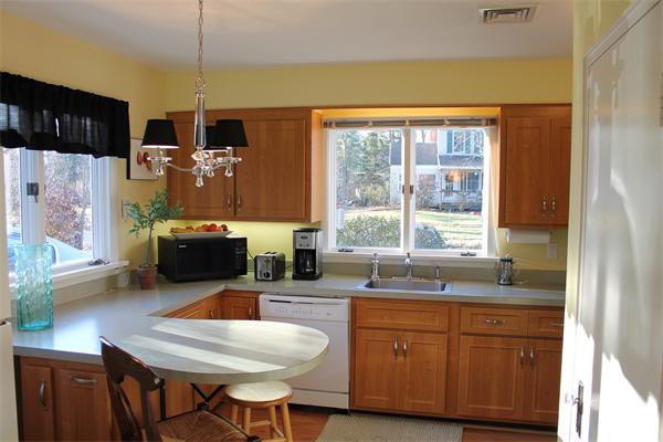 21 Longfellow Road Natick, MA 01760 - Photo 7 of 28 a kitchen with a stove a sink and a refrigerator
