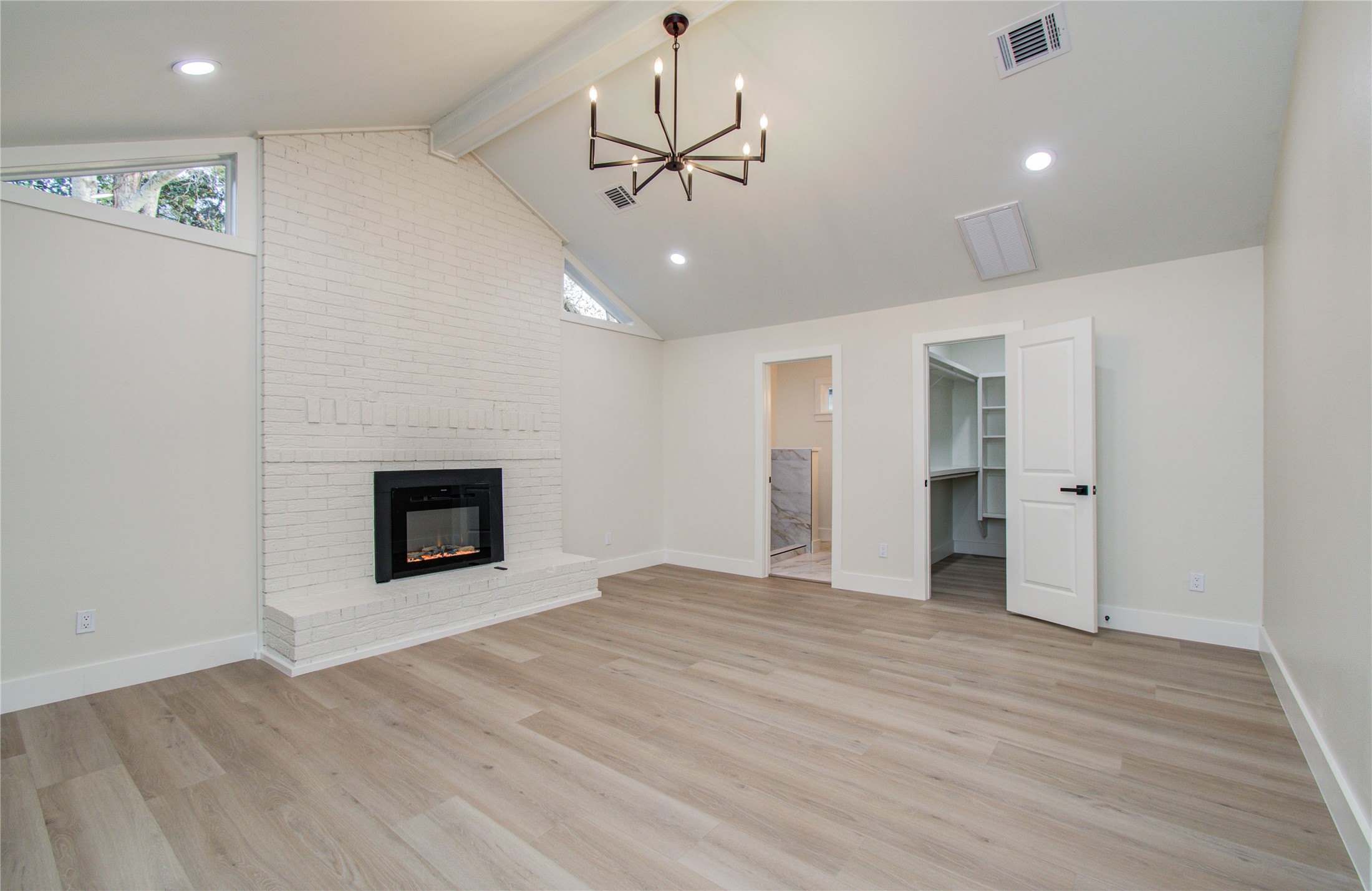 727 Travis Street Columbus, TX 78934 - Photo 25 of 36 a view of an empty room with a fireplace and a window