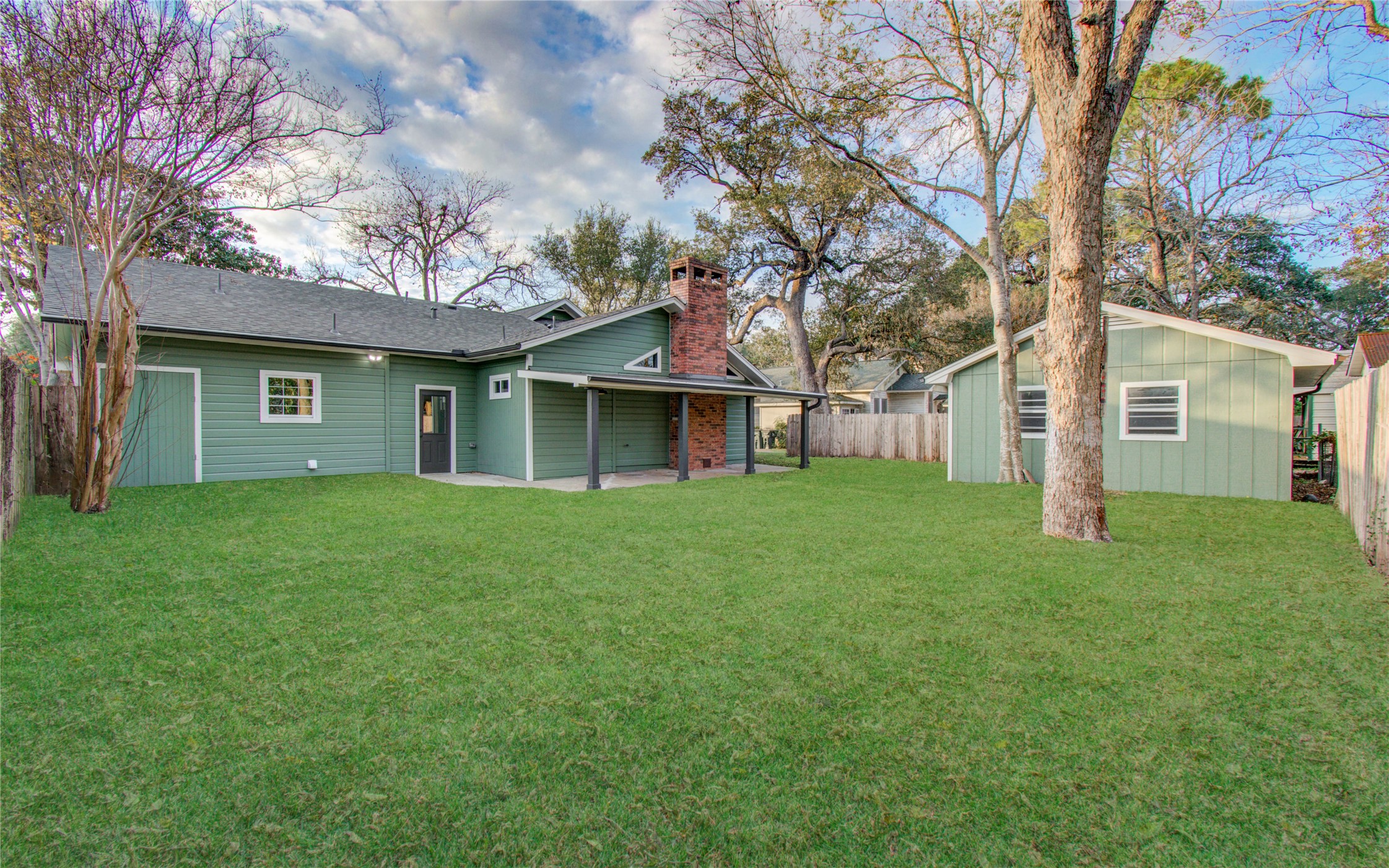 727 Travis Street Columbus, TX 78934 - Photo 32 of 36 The backyard has plenty of space and a cozy covered back porch