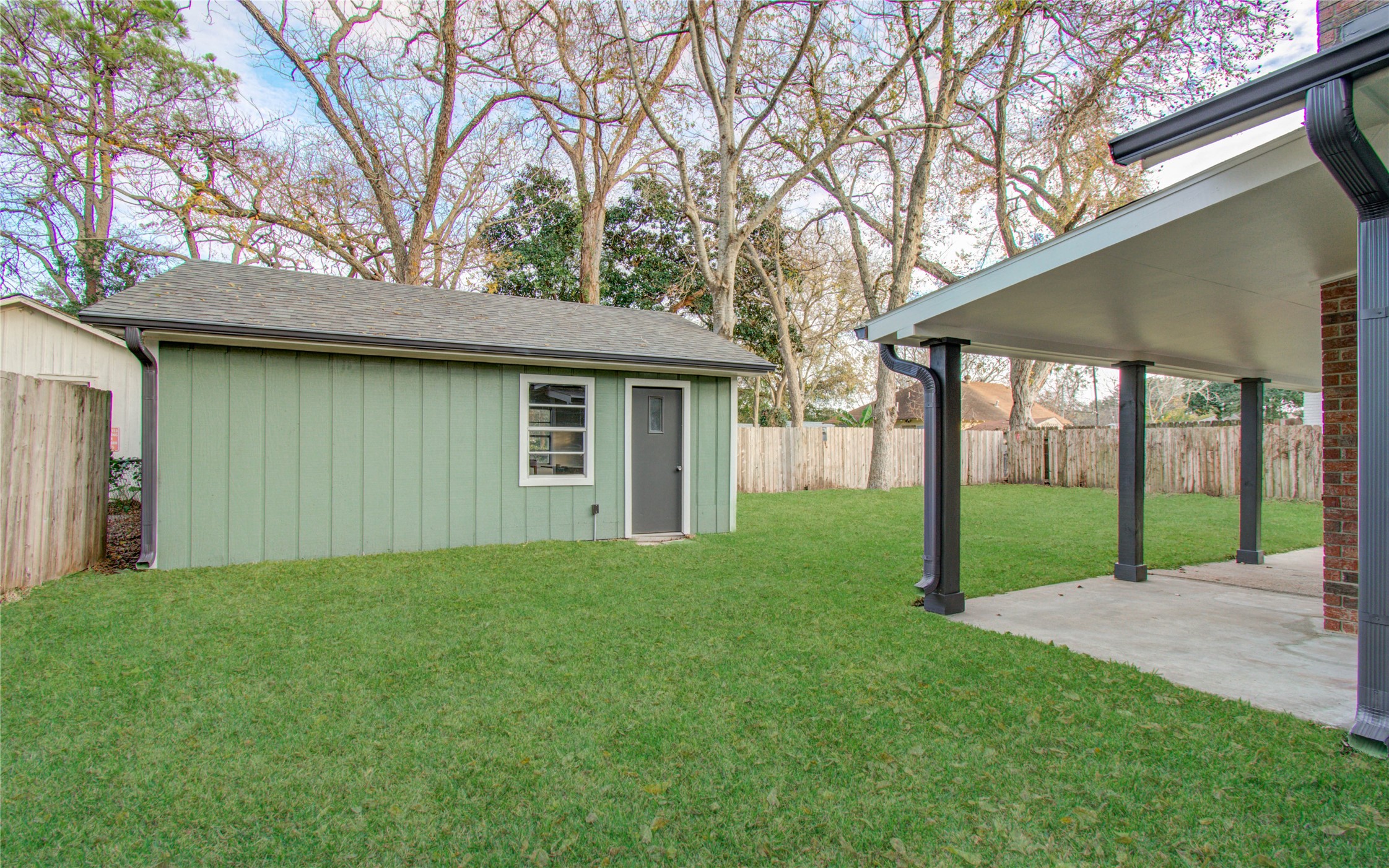 727 Travis Street Columbus, TX 78934 - Photo 35 of 36 a view of a house with yard and tree s