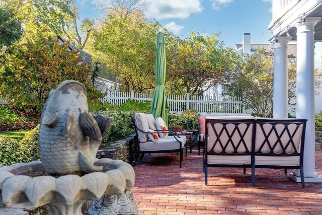 a view of a patio in the backyard