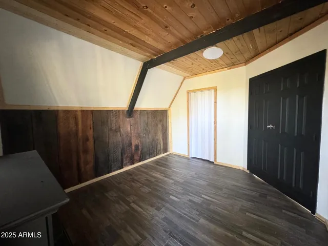 an empty room with wooden floor