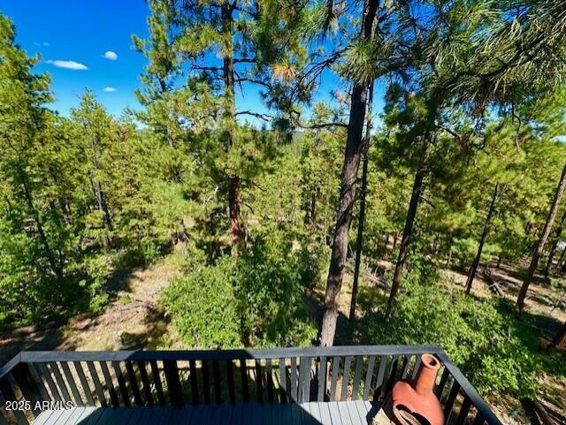 1725 Turkey Mountain Road Happy Jack, AZ 86024 - Photo 22 of 35 a view of balcony with wooden floor and outdoor seating