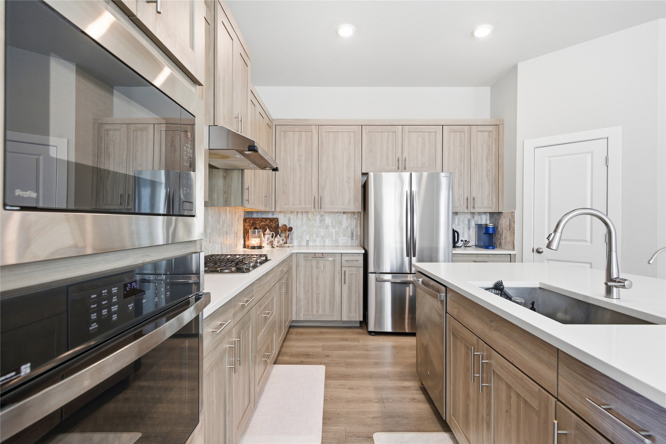 1008 Summer Glen Georgetown, TX 78628 - Photo 13 of 34 a kitchen with refrigerator and cabinets