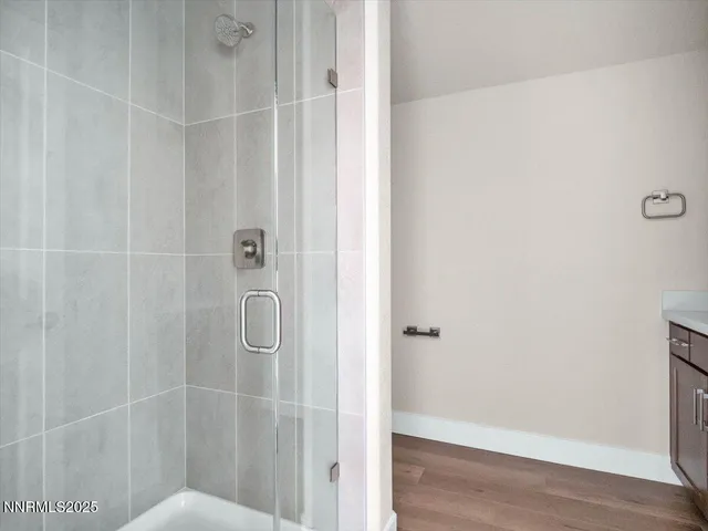 a view of a room with a ceiling fan