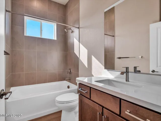 a view of an empty room and wooden floor