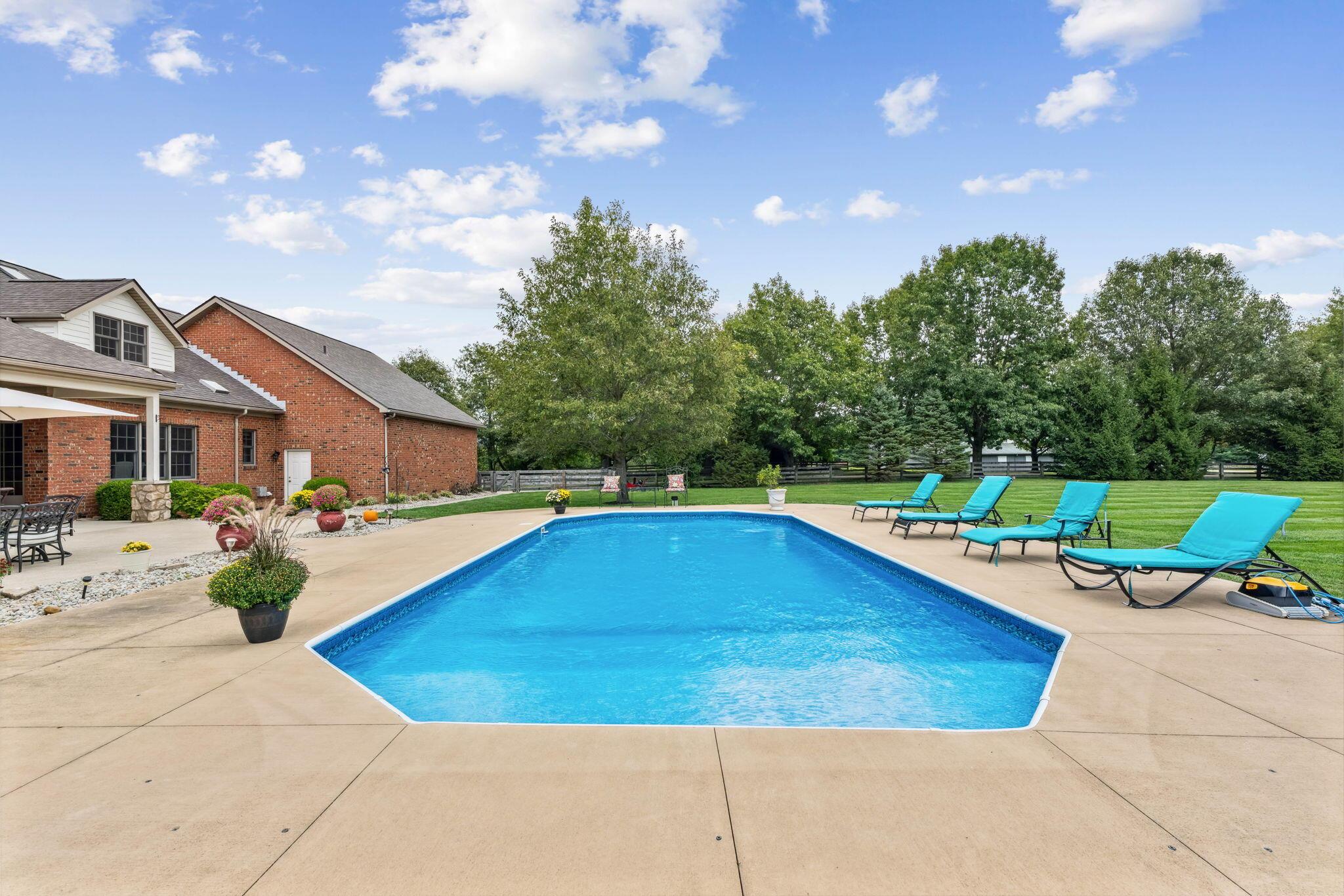 8242 Dustin Road Galena, OH 43021 - Photo 73 of 111 In-gorund pool has sundeck/tanning area that leads to 8 ft depth