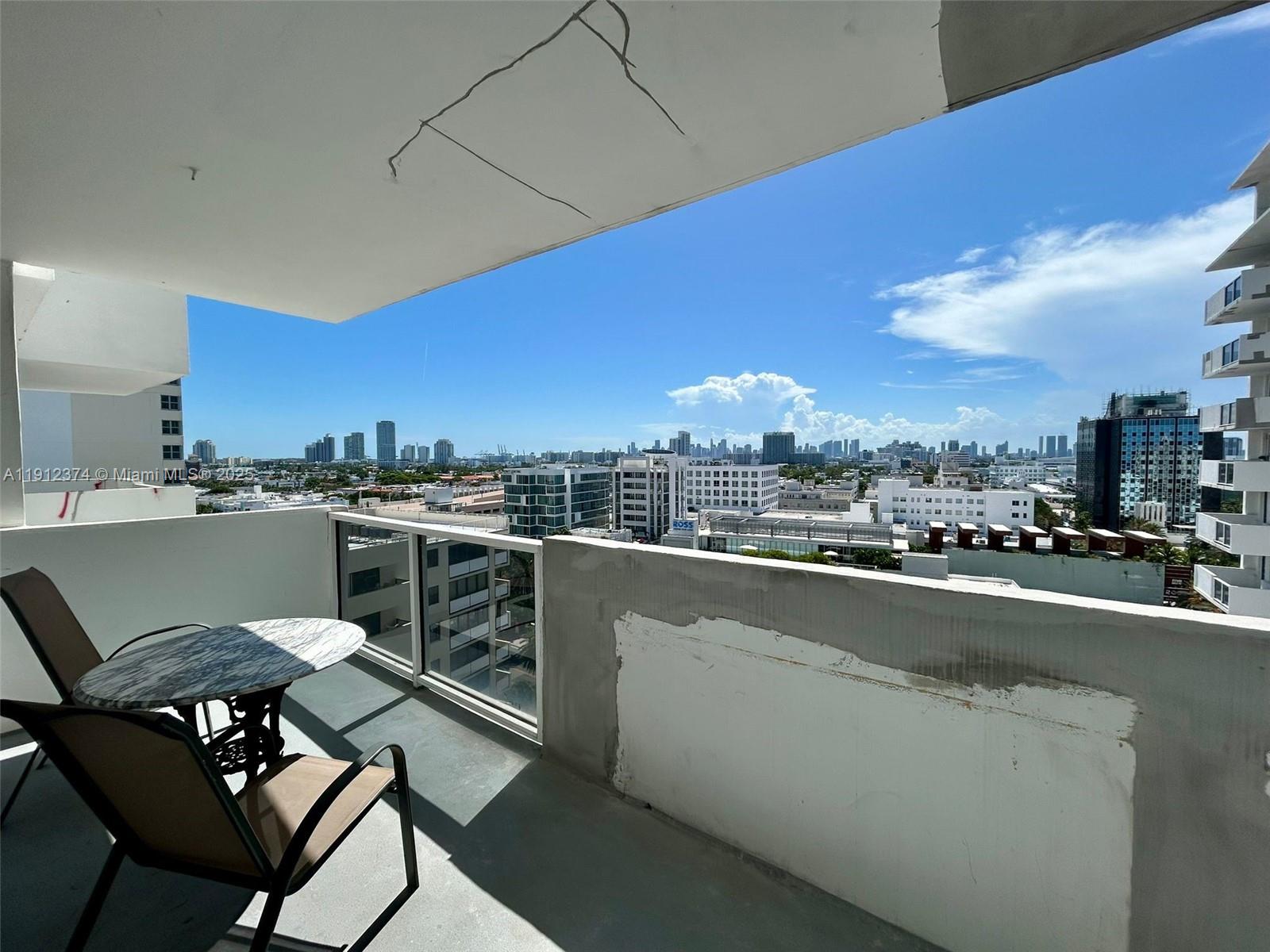 100 Lincoln Road, Unit 1220 Miami Beach, FL 33139 - Photo 10 of 10 a view of a chairs and table in the terrace