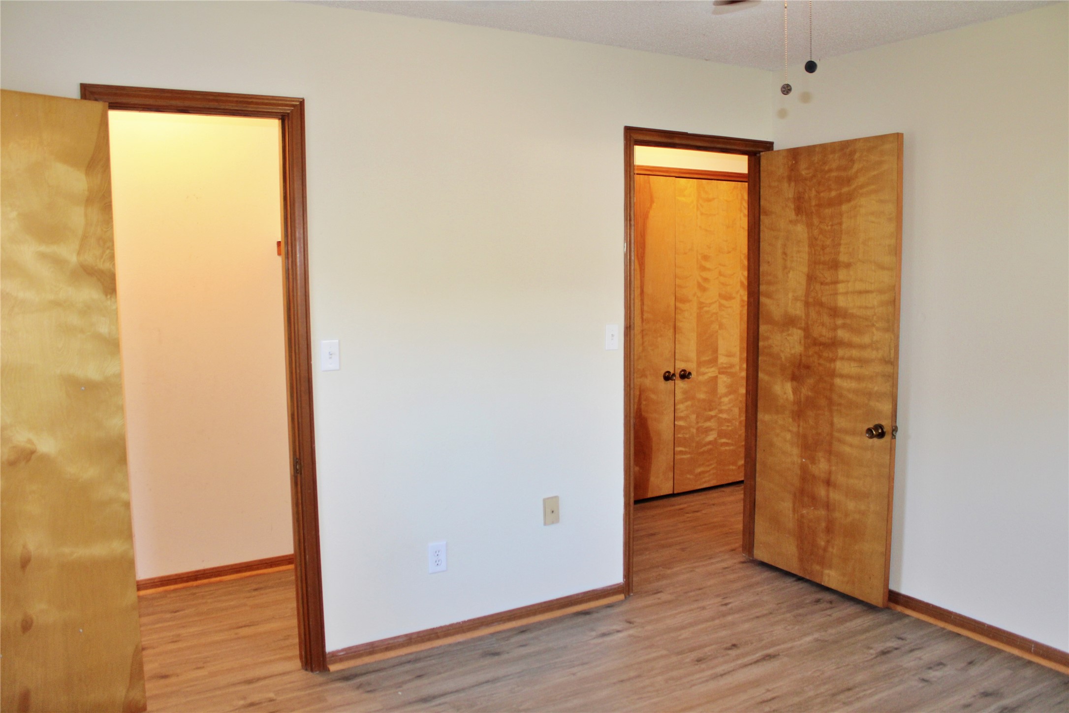 1126 Jackson Street Columbus, TX 78934 - Photo 12 of 40 a view of walk in closet with wooden floor