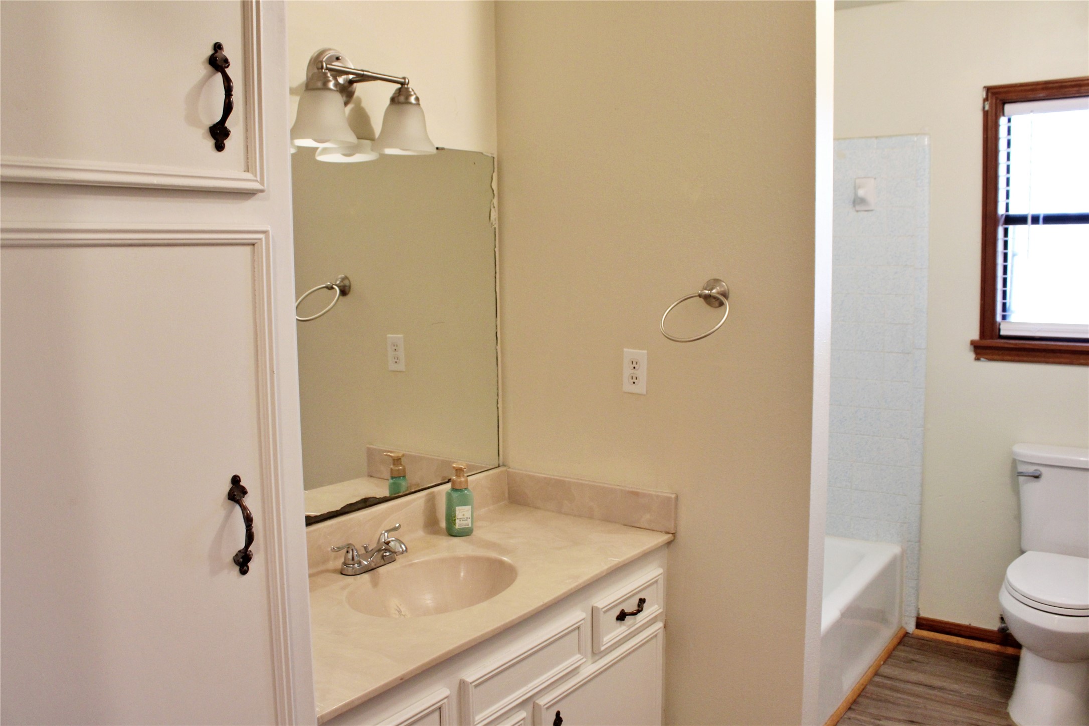 1126 Jackson Street Columbus, TX 78934 - Photo 14 of 40 a bathroom with a sink a toilet and shower