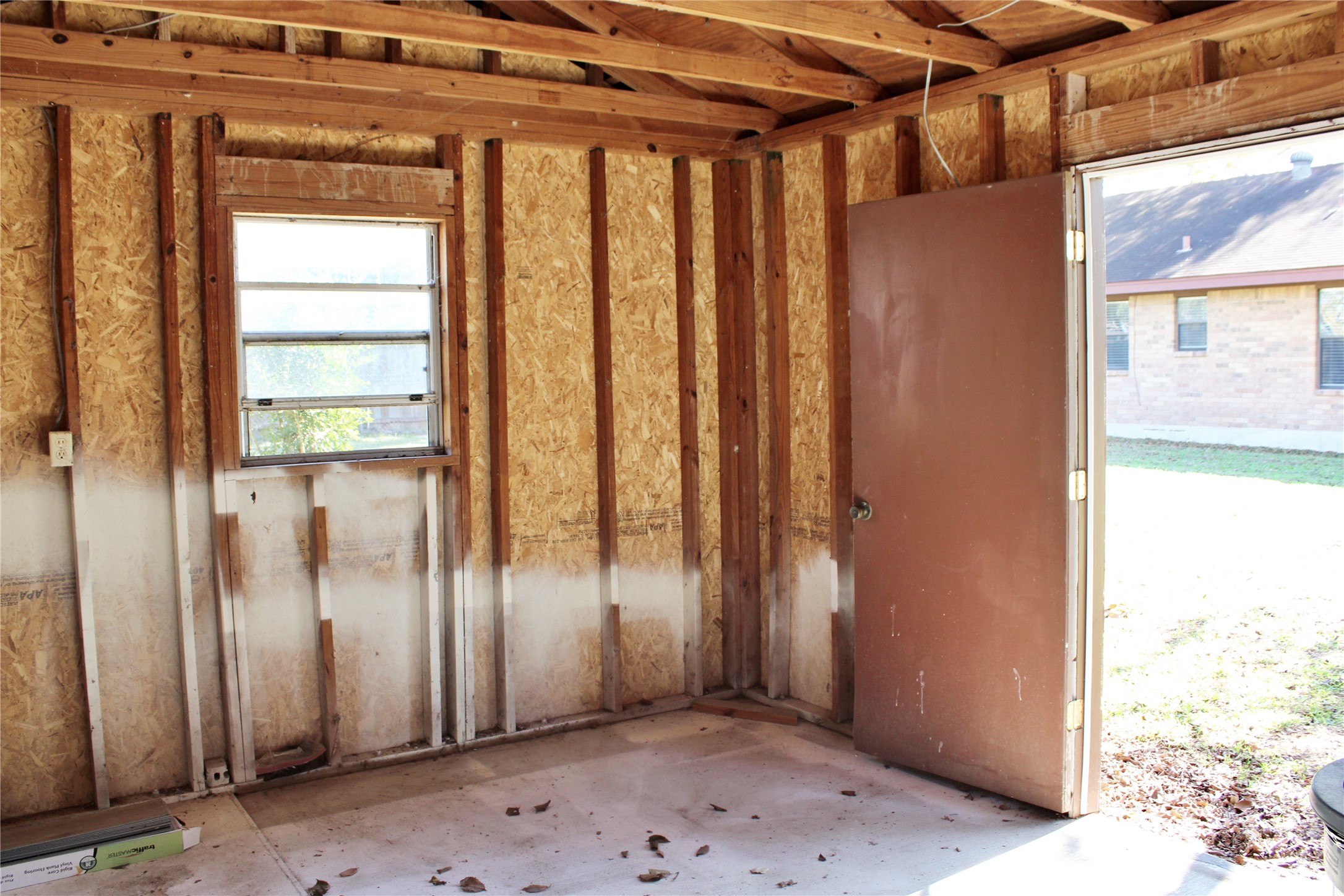 1126 Jackson Street Columbus, TX 78934 - Photo 33 of 40 a view of a porch with wooden floor and a window