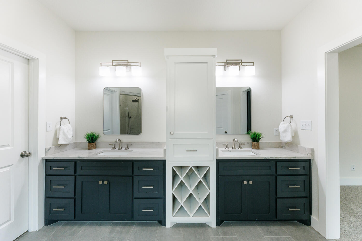 3819 58th Street Lubbock, TX 79413 - Photo 33 of 63 a spacious bathroom with a granite countertop sink and a mirror