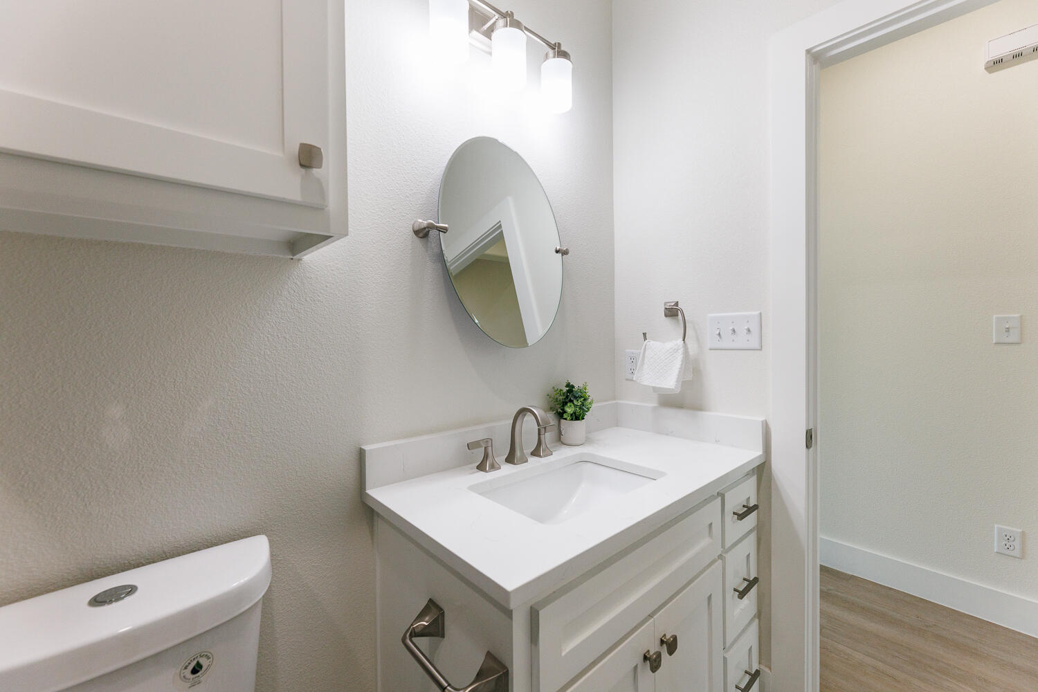 3819 58th Street Lubbock, TX 79413 - Photo 45 of 63 a bathroom with a sink and a mirror