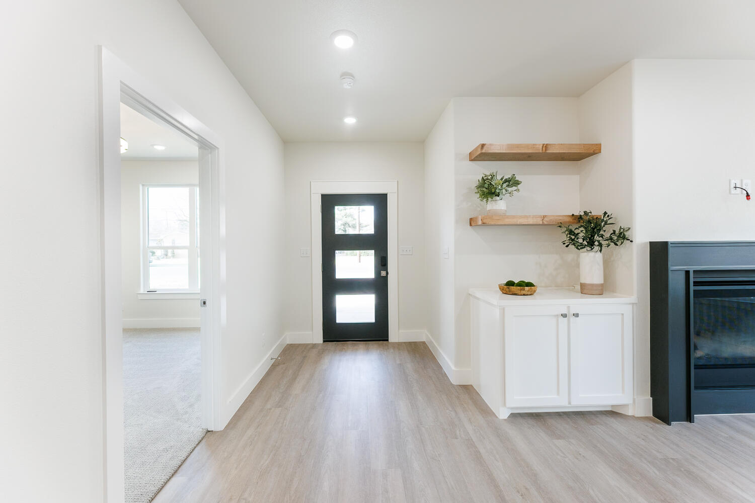 3819 58th Street Lubbock, TX 79413 - Photo 6 of 63 wooden floor in an empty room with a window