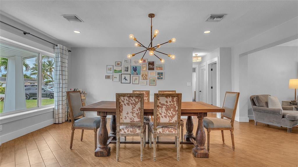 2800 Northeast 53rd Street Lighthouse Point, FL 33064 - Photo 12 of 34 a view of a dining room with furniture window and wooden floor
