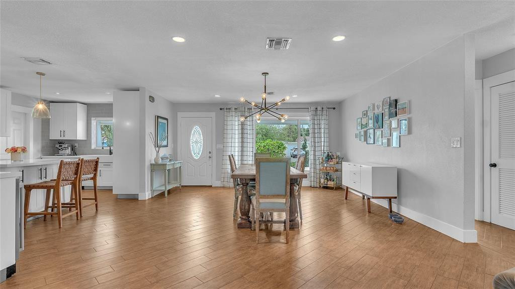 2800 Northeast 53rd Street Lighthouse Point, FL 33064 - Photo 14 of 34 a view of a dining room with furniture and wooden floor